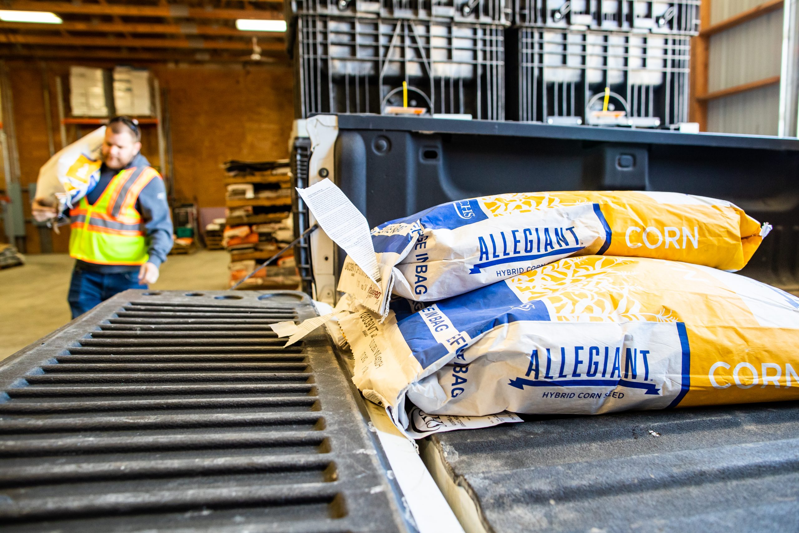 Allegiant seed bags on the back of a truck